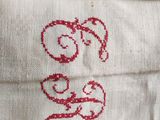 a close up of a piece of cloth with a red design on it