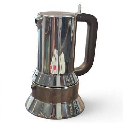 a coffee pot that is sitting on top of a table