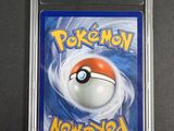 a close up of a pokemon card on a table