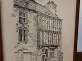 a picture of a drawing of a building in a frame