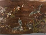 a wooden box with a painting of birds and flowers on it