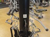 a gym with a lot of machines on the floor
