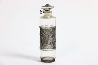 a small glass bottle with a silver lid and a silver lid
