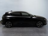 the black car is parked on the concrete floor in the room