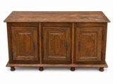 an old wooden cabinet with three doors and two drawers