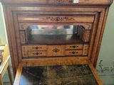 a wooden table with a marble top on it