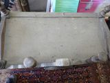 a chair that is sitting on a rug on the floor