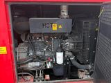a red truck with a large engine in the back