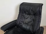 black leather swive chair with foot rest and foot rest