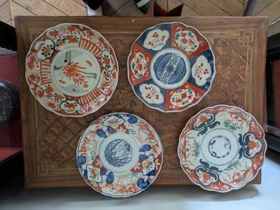 four plates that are sitting on a table