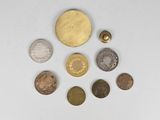 several coins are arranged in a circle on a white surface