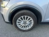 a close up of a car ' s tire on the road