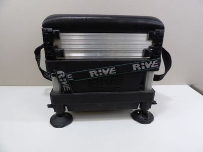 a black suitcase with a black handle on a white table