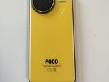 a close up of a yellow camera on a white surface