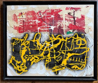 yellow and black graffiti on a piece of paper on a wooden surface
