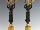 pair of antique bronze candlesticks on marble bases