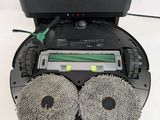 a picture of a robot cleaning a floor with a pair of wheels