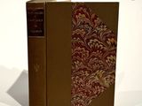 a book that is sitting on a white surface