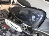 a motorcycle that is sitting on a carpet in a room