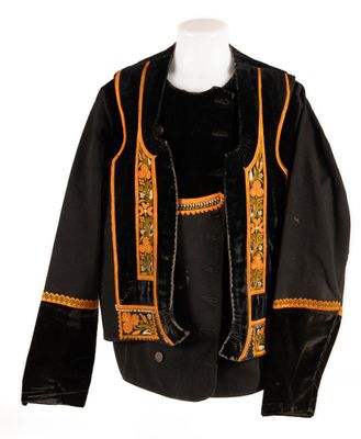 an image of a black jacket with orange trims on a mannequin