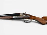 an old gun with a wooden handle on a white background