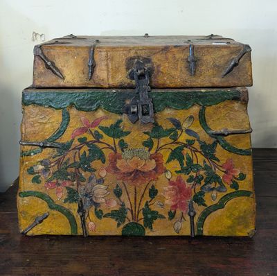 a wooden box with a floral design on it