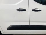 the side door of a white van with black trims
