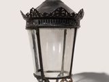 a black lamp with a crown on top of it