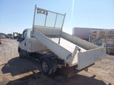 a white truck that is parked in the dirt