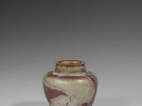 an image of a vase with a bird design on it