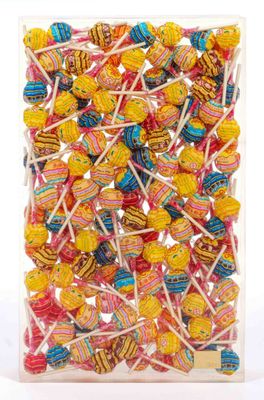 a close up of a bag of colorful lollipops on a white background