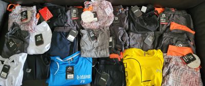 a lot of clothes that are in a box together