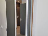 a mirror hanging on the wall in the hallway