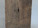 an image of a piece of wood with a keyhole on it