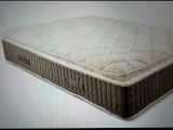 a mattress that is sitting on a white surface