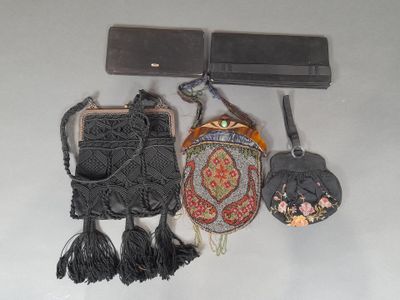 three purses hanging on a wall next to each other