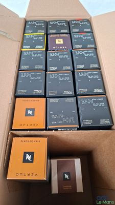 a cardboard box filled with many different types of cigarettes