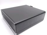 an image of a small black computer on a white surface