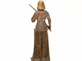 bronze statue of a woman with a sword in her hand