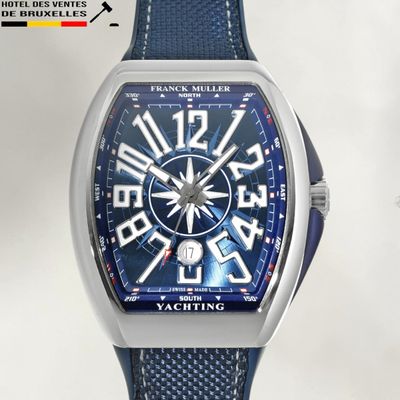 a close up of a wrist watch with a blue face