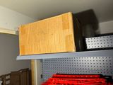 a box sitting on top of a shelf in a room