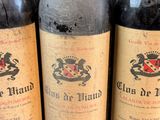 several bottles of wine are lined up on a table