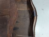 a wooden desk with a drawer on top of it