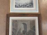 two framed pictures hanging on the wall of a room