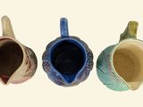 three different types of coffee mugs sitting next to each other
