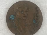 a picture of a coin with a picture of a man on it