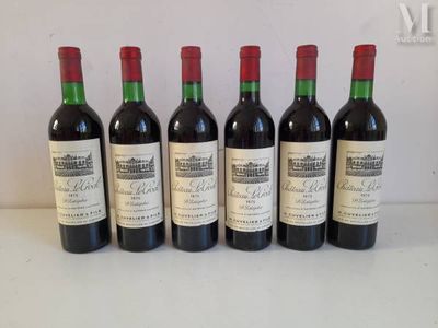 six bottles of wine are lined up on a table