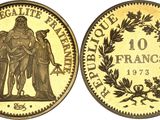 a gold coin with the image of a woman and a man on it