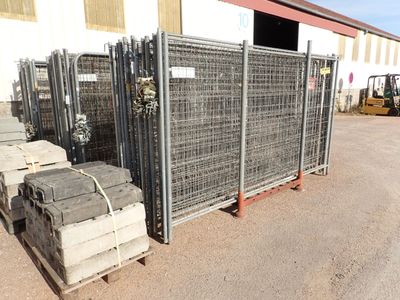many crates of cement sitting in front of a building