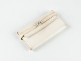 an image of a white purse sitting on top of a white table